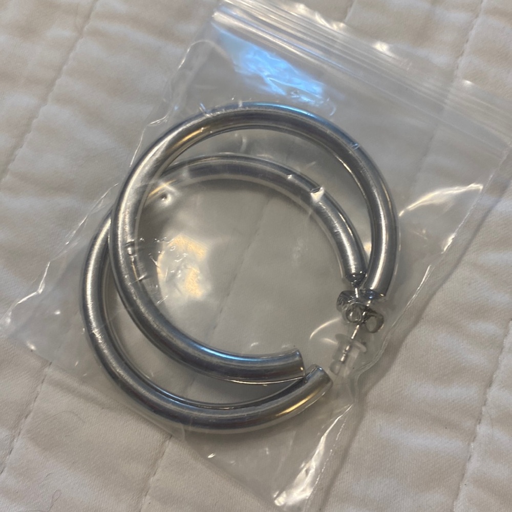 Never worn silver hoop earrings